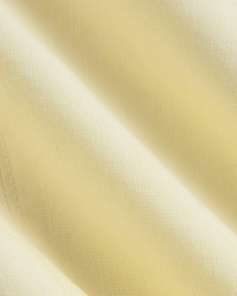 The Shift Dress in Stretch Linen in Light Yellow — detail view