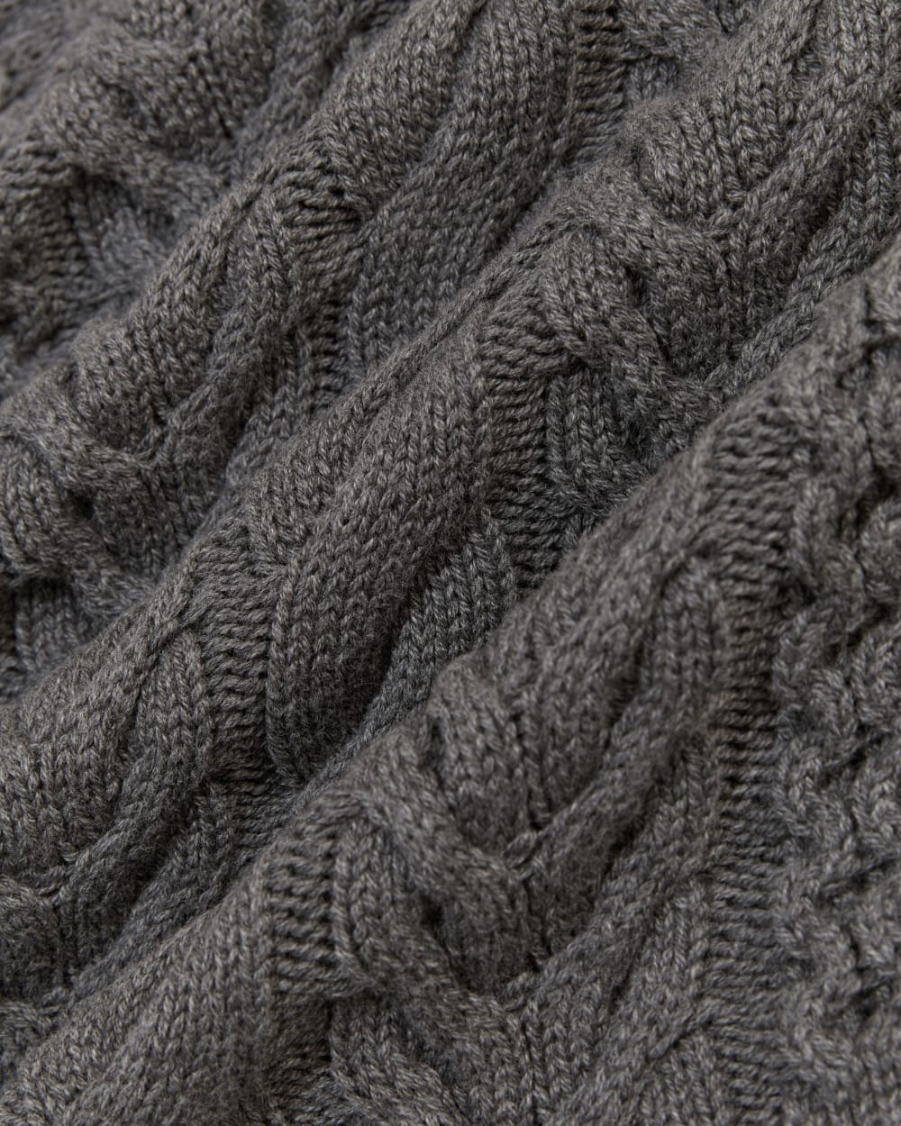 The Cable Sweater in Everyday Cotton in Heathered Charcoal — detail view