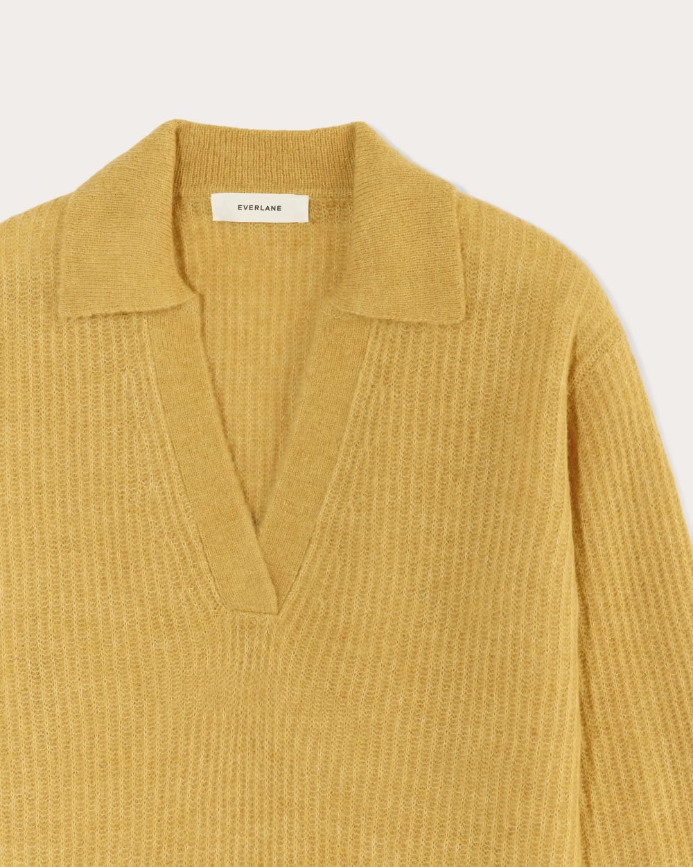 The Oversized Polo in Alpaca in Golden Yellow — detail view