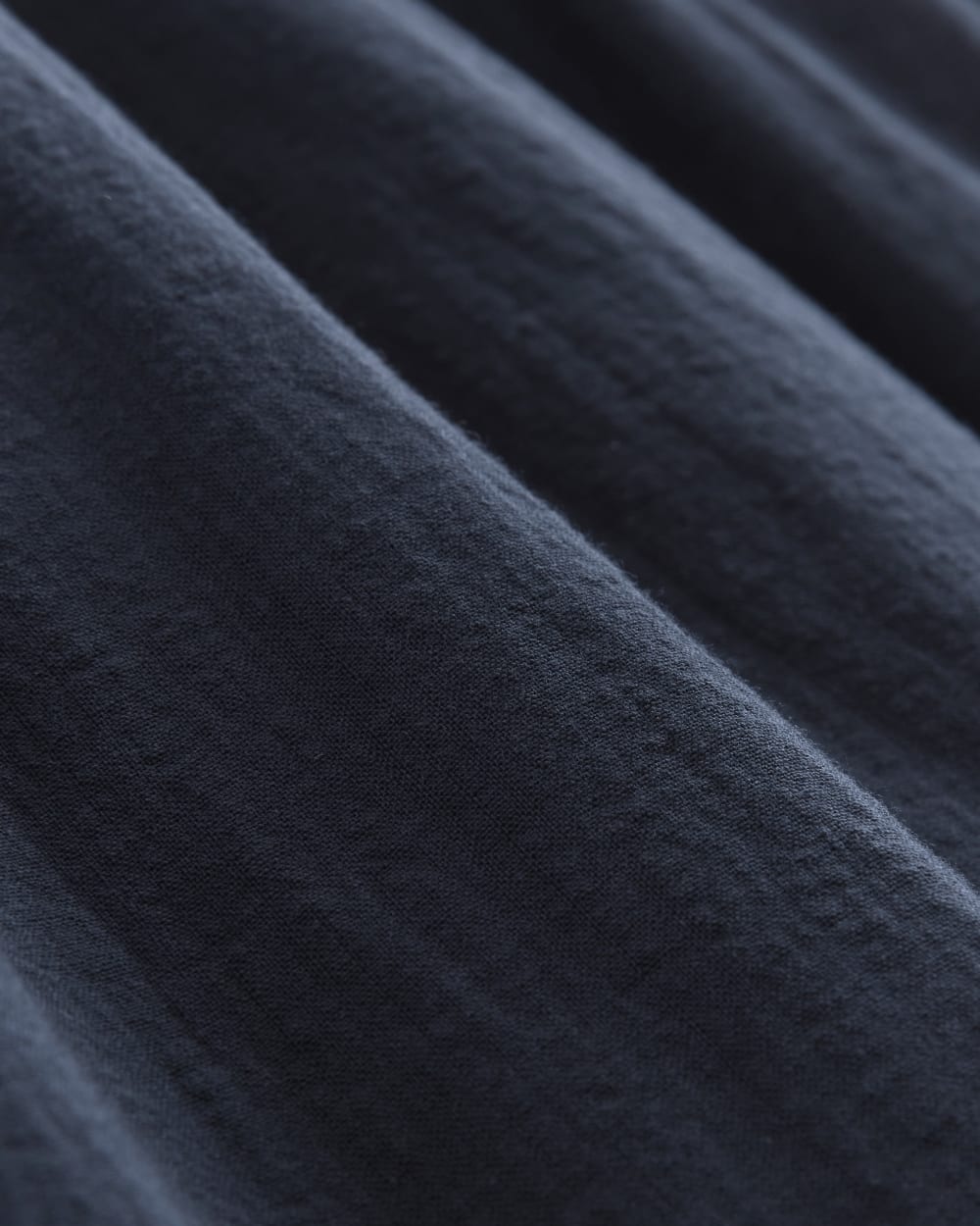 The Gauze Smock Dress in Navy — detail view