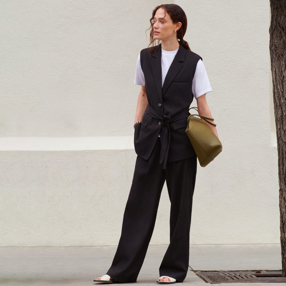 The Sleeveless Blazer in Buttersmooth in Black — detail view