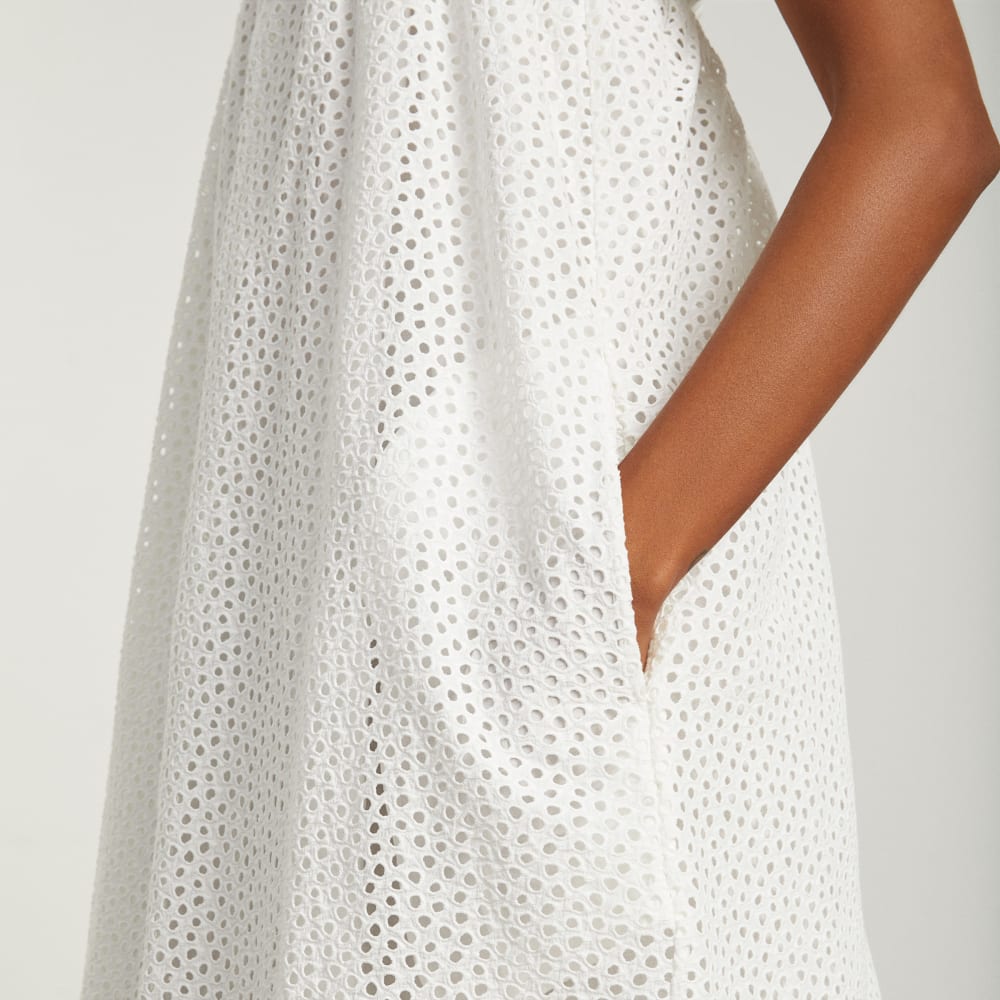 The Eyelet Smock Dress in White — detail view