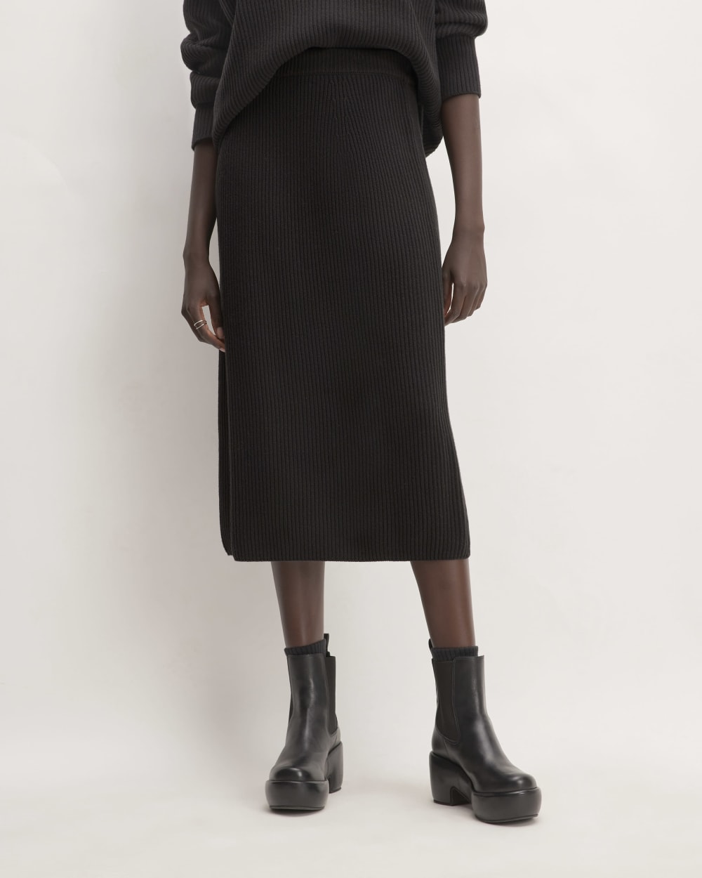 The Organic Cotton Sweater Midi Skirt in Black — front view