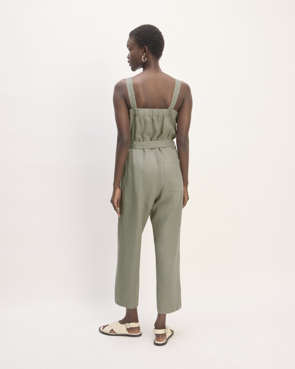 The Linen Side-Button Jumpsuit in Sage Green — detail view