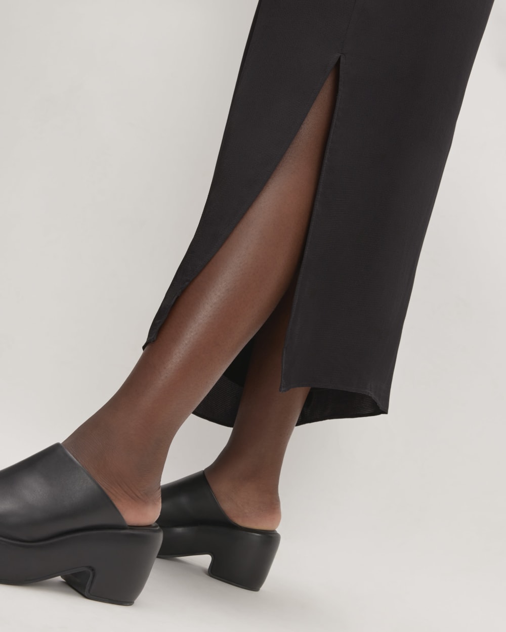 The Hammered Satin Slip Dress in Black — detail view