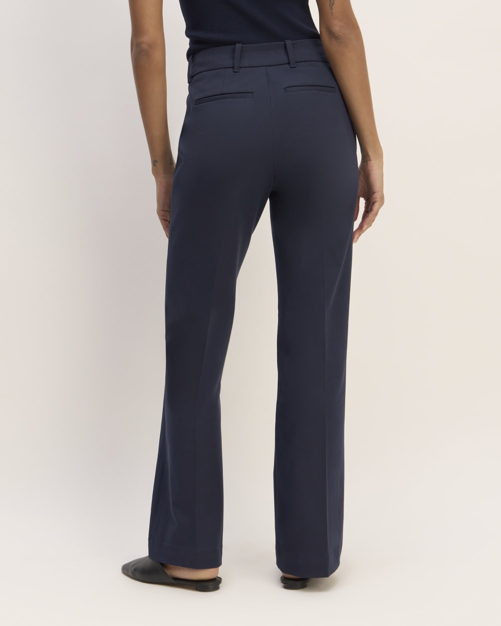 The Bi-Stretch Flare Pant in Navy — detail view
