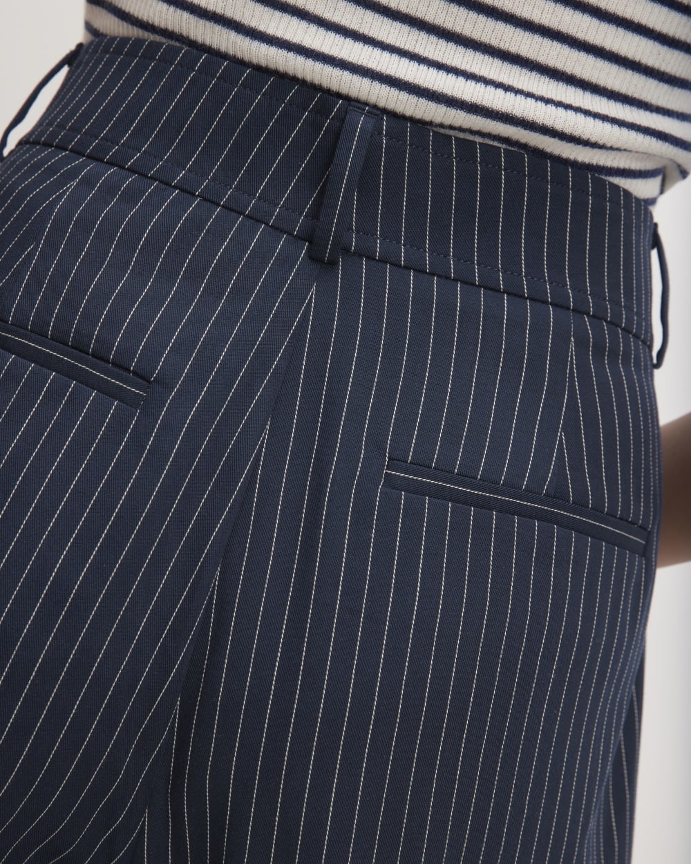 The Draper Tapered Pant in Buttersmooth in Navy / Bone — detail view
