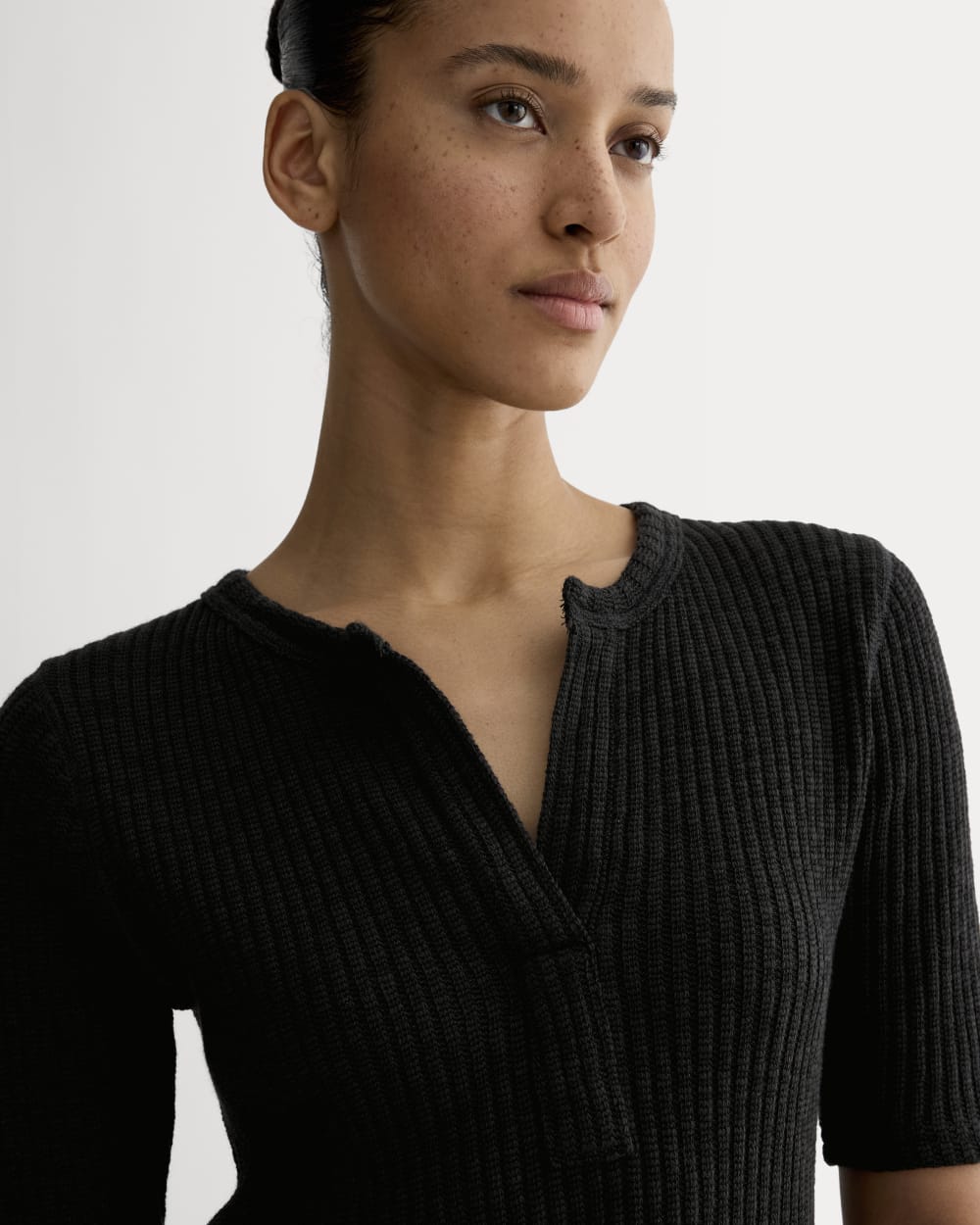 The Rib-Knit Short-Sleeve Henley in Black — detail view
