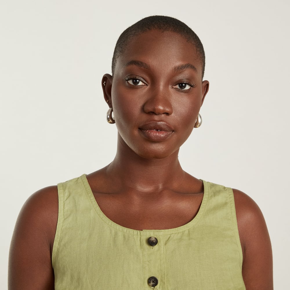 The Linen Button-Front Crop Tank in Leek — detail view