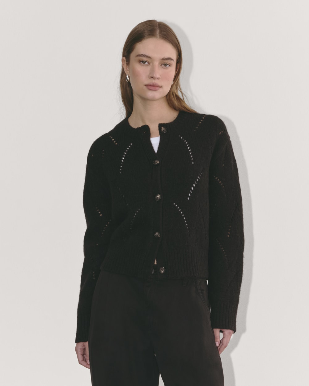 The Pointelle Cardigan in Cloud in Black — front view
