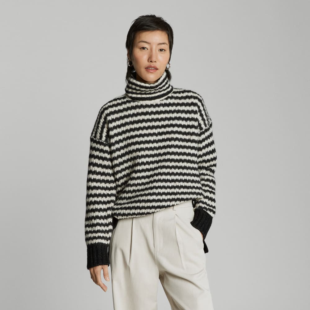 The Cloud Turtleneck in Black / Oatmeal — front view