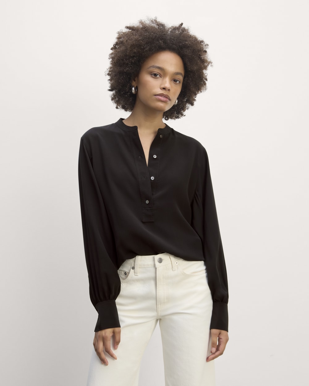 The Henley Shirt in Washable Silk in Black — front view