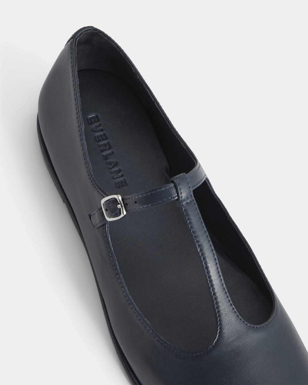 The Leather T-Strap Flat in Navy — detail view
