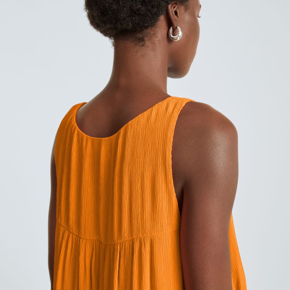 The Naia™ Ripple Tank Dress in Turmeric — detail view
