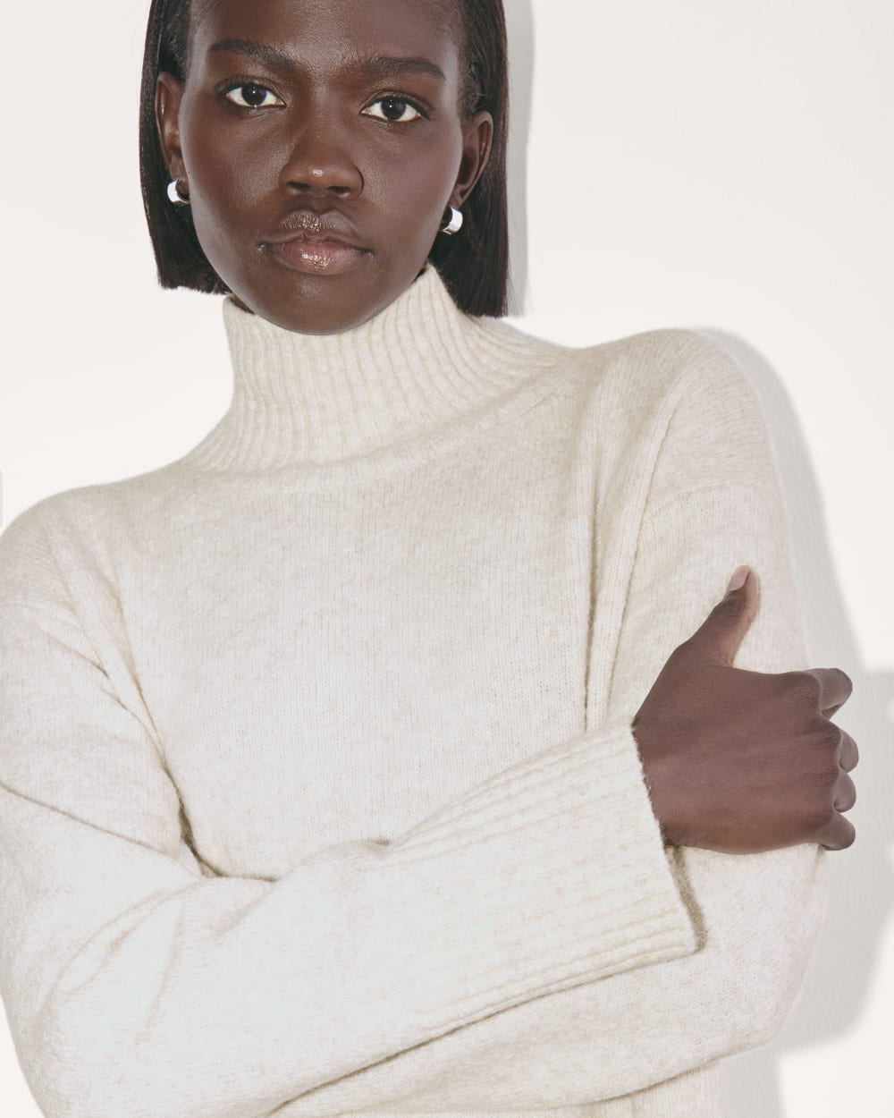 The Sweater Dress in Plush Cotton in Heathered Oat — detail view