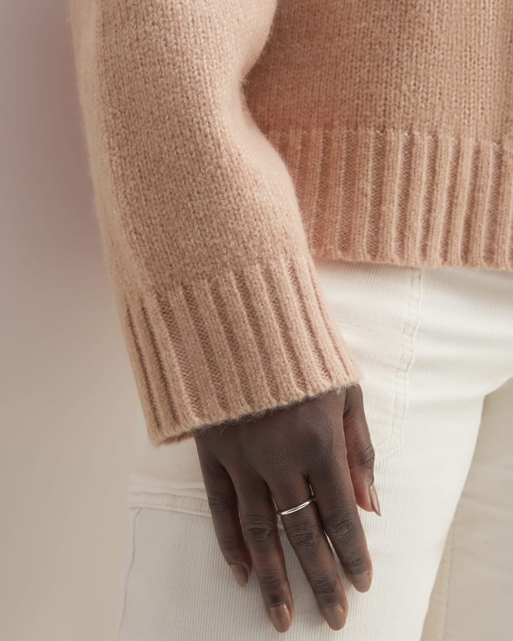 The Cloud Oversized Turtleneck in Blush Pink — detail view