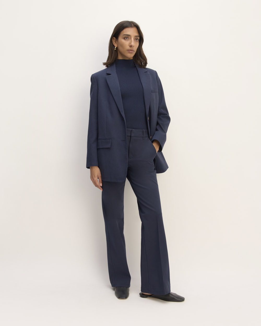 The Bi-Stretch Flare Pant in Navy — front view