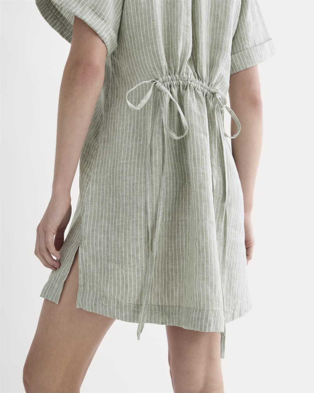 The Popover Dress in Linen in Oil Green / White — detail view