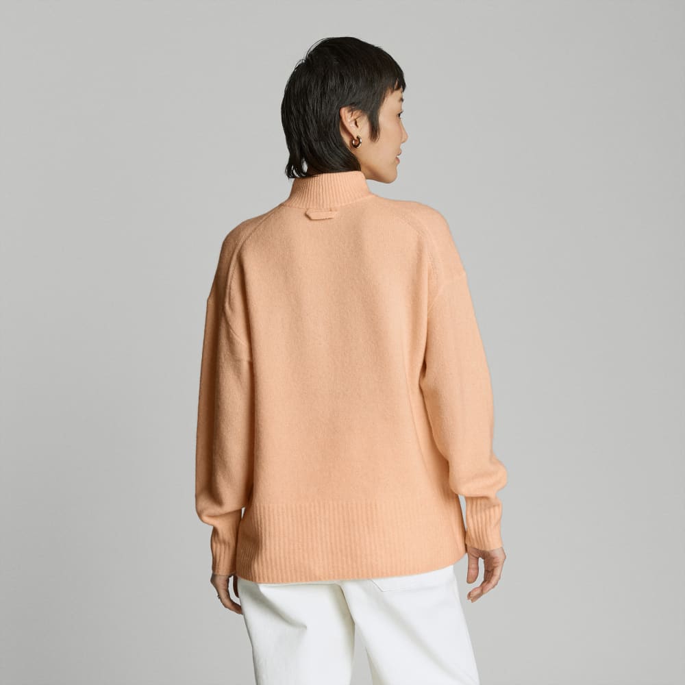 The Cozy-Stretch Pullover in Apricot — detail view