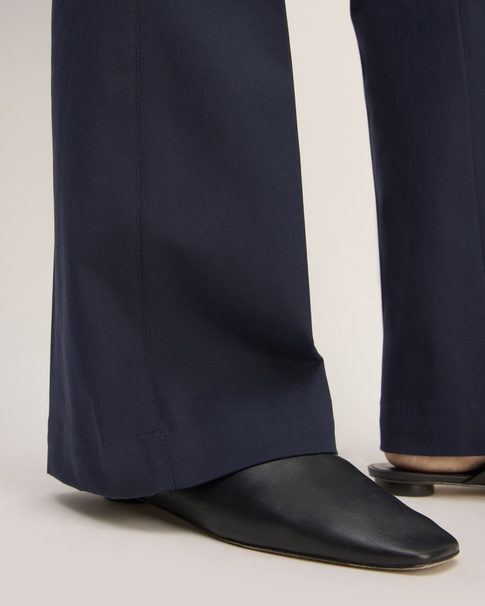 The Bi-Stretch Flare Pant in Navy — detail view