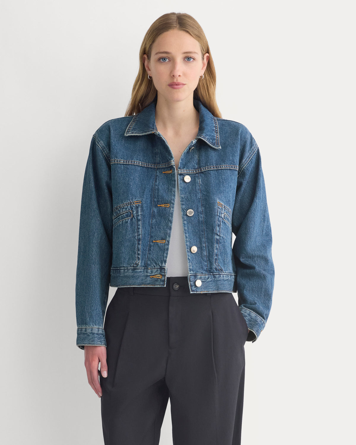 Cropped Trucker Jacket in Denim in Mid Indigo — front view