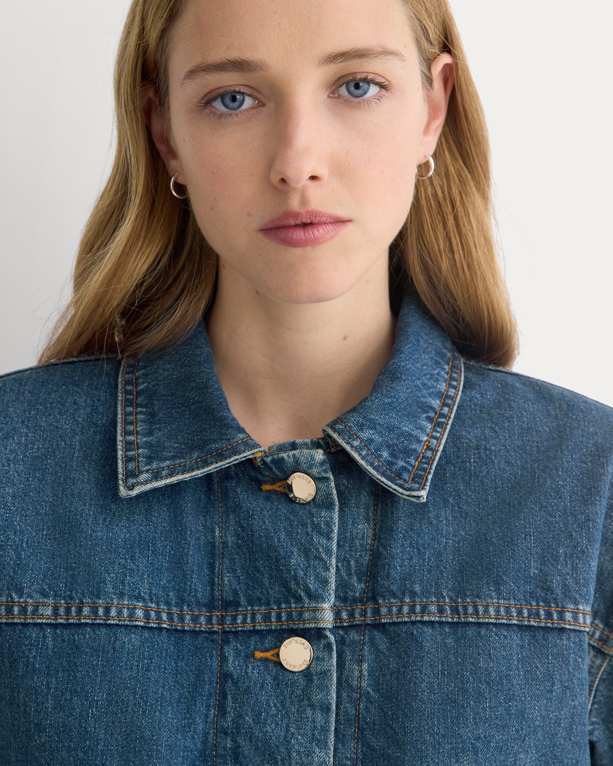 Cropped Trucker Jacket in Denim in Mid Indigo — detail view
