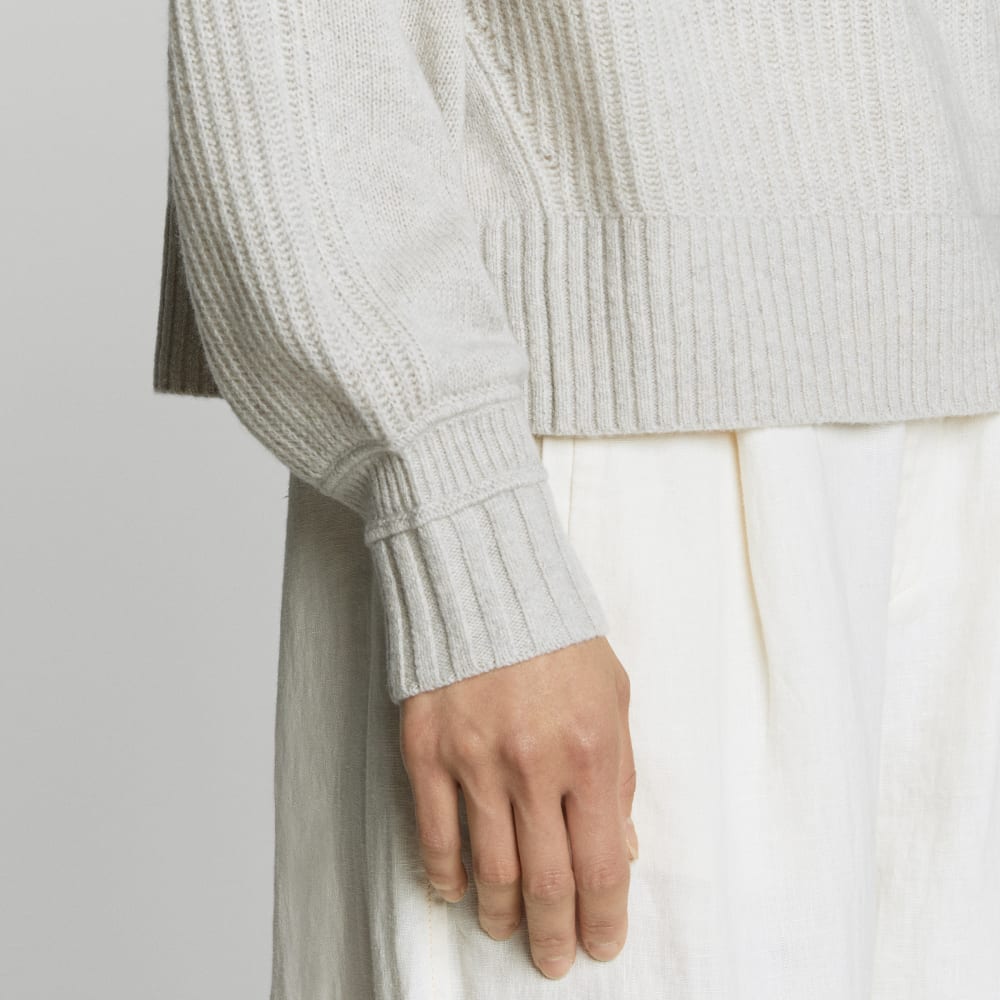 The Cashmere Ribbed Turtleneck in Pale Heathered Grey — detail view