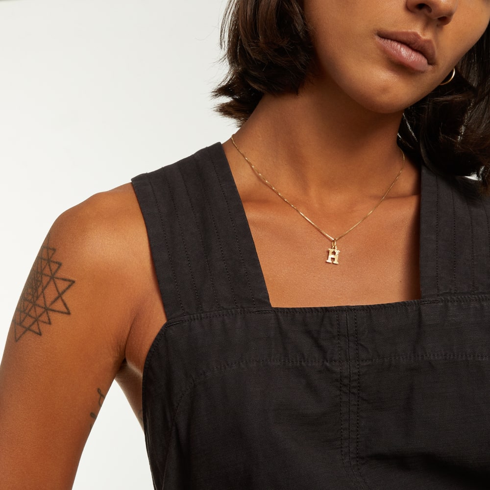 The Fatigue Apron Jumpsuit in Black — detail view
