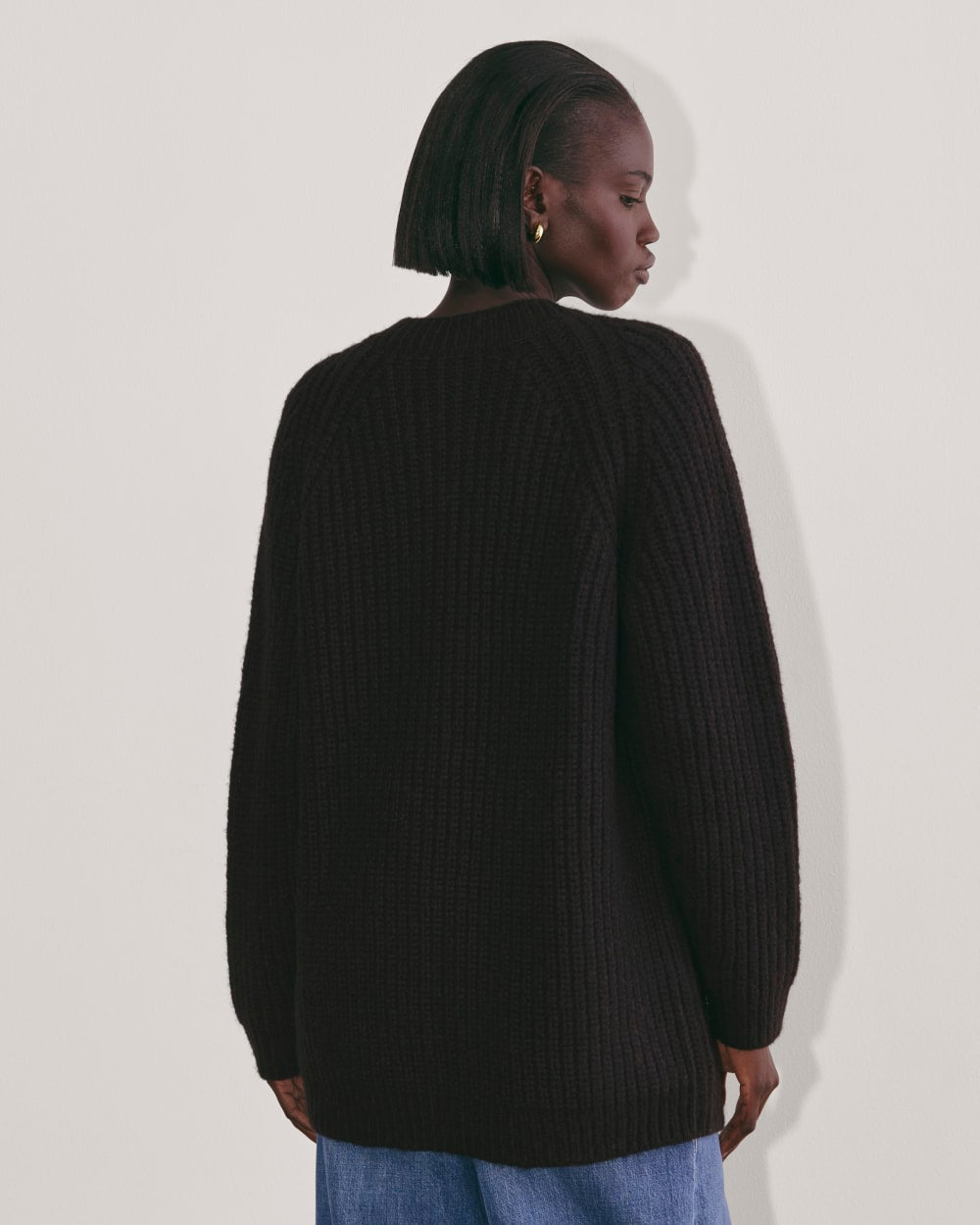 The Fisherman Cardigan in Cloud in Black — detail view