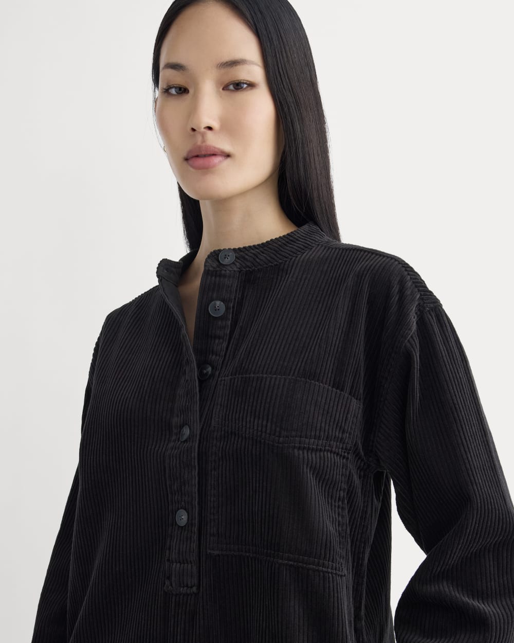 The Corduroy Mini Dress in Black — detail view