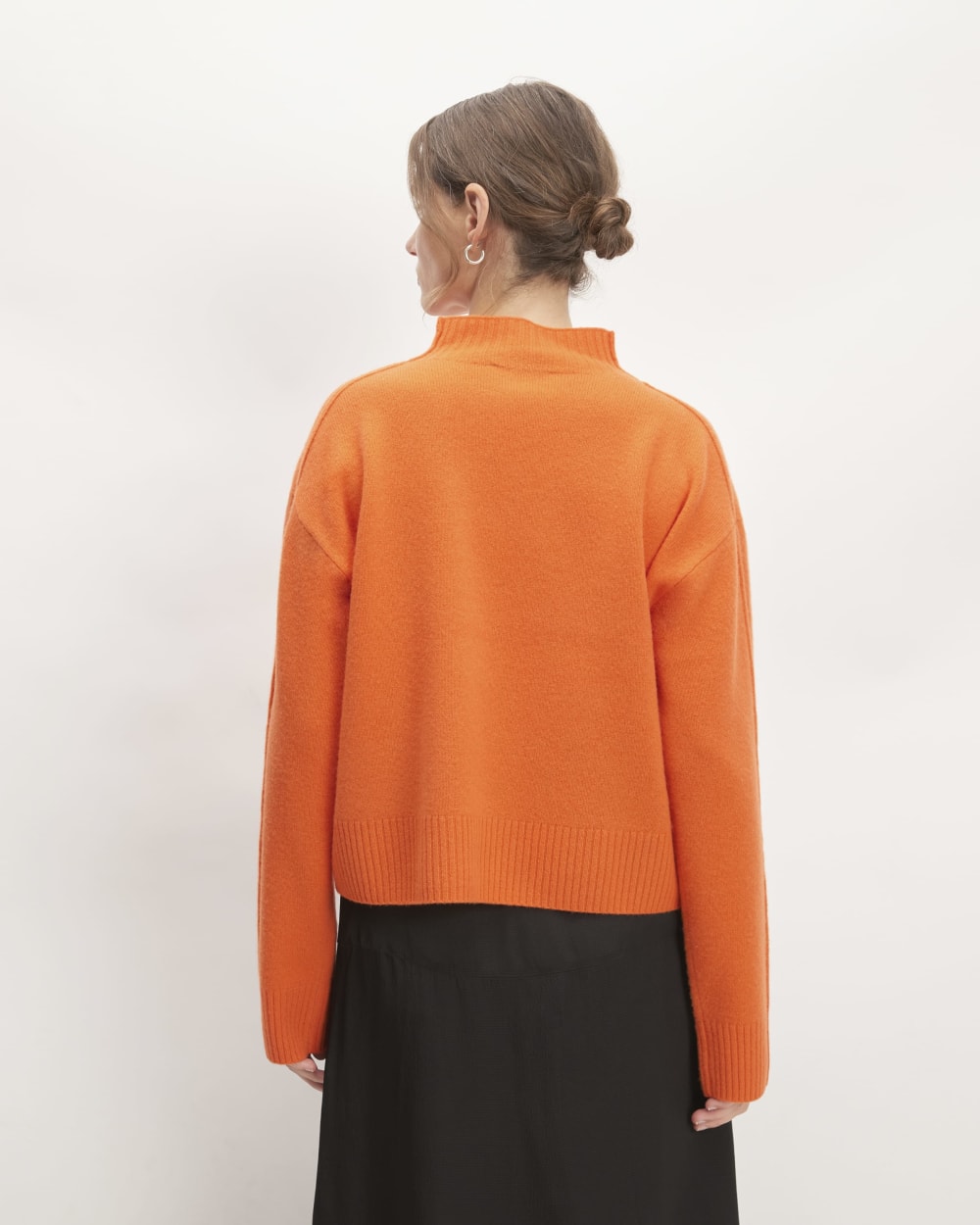 The Good Merino Wool Mockneck Sweater in Orange — detail view