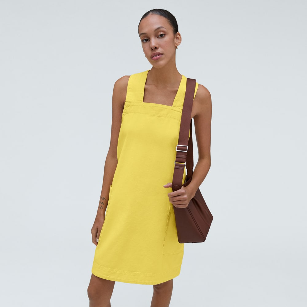 The Cross-Back Apron Mini Dress in Lemon — detail view