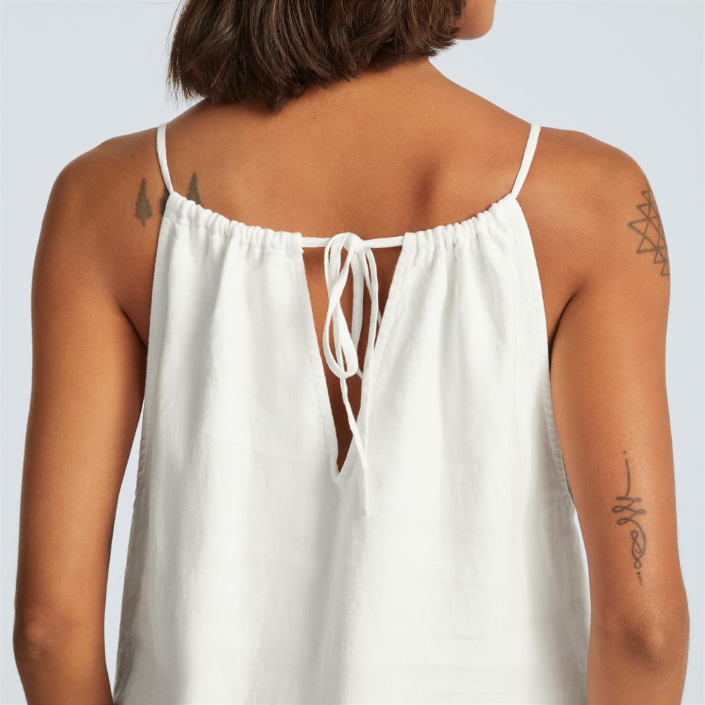 The Linen Apron Dress in White — detail view