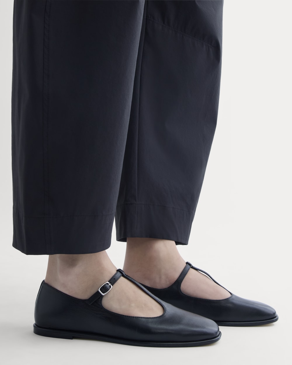 The Leather T-Strap Flat in Black — detail view