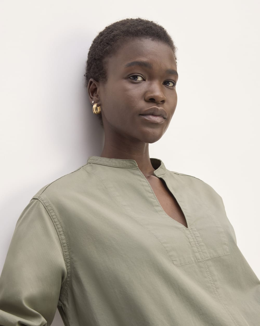 The Long-Sleeve Utility Mini Dress in Sage Green — detail view