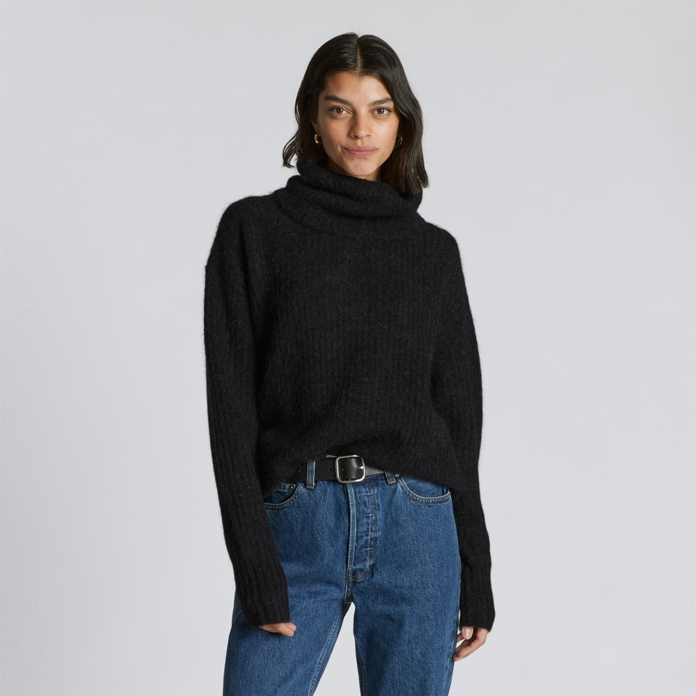 The Alpaca Oversized Turtleneck in Heathered Black — front view