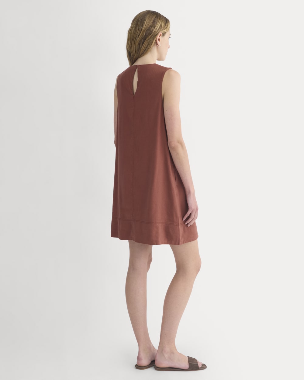The Shift Dress in Stretch Linen in Henna Red — detail view