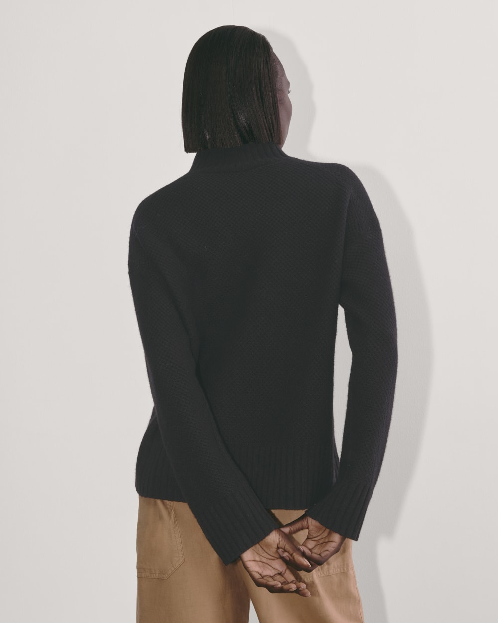 The Honeycomb Funnel Neck in Wool Cashmere in Black — detail view