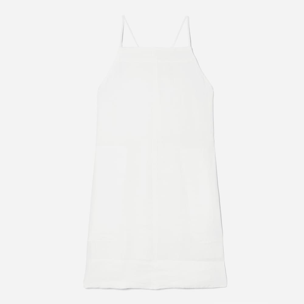 The Linen Apron Dress in White — front view