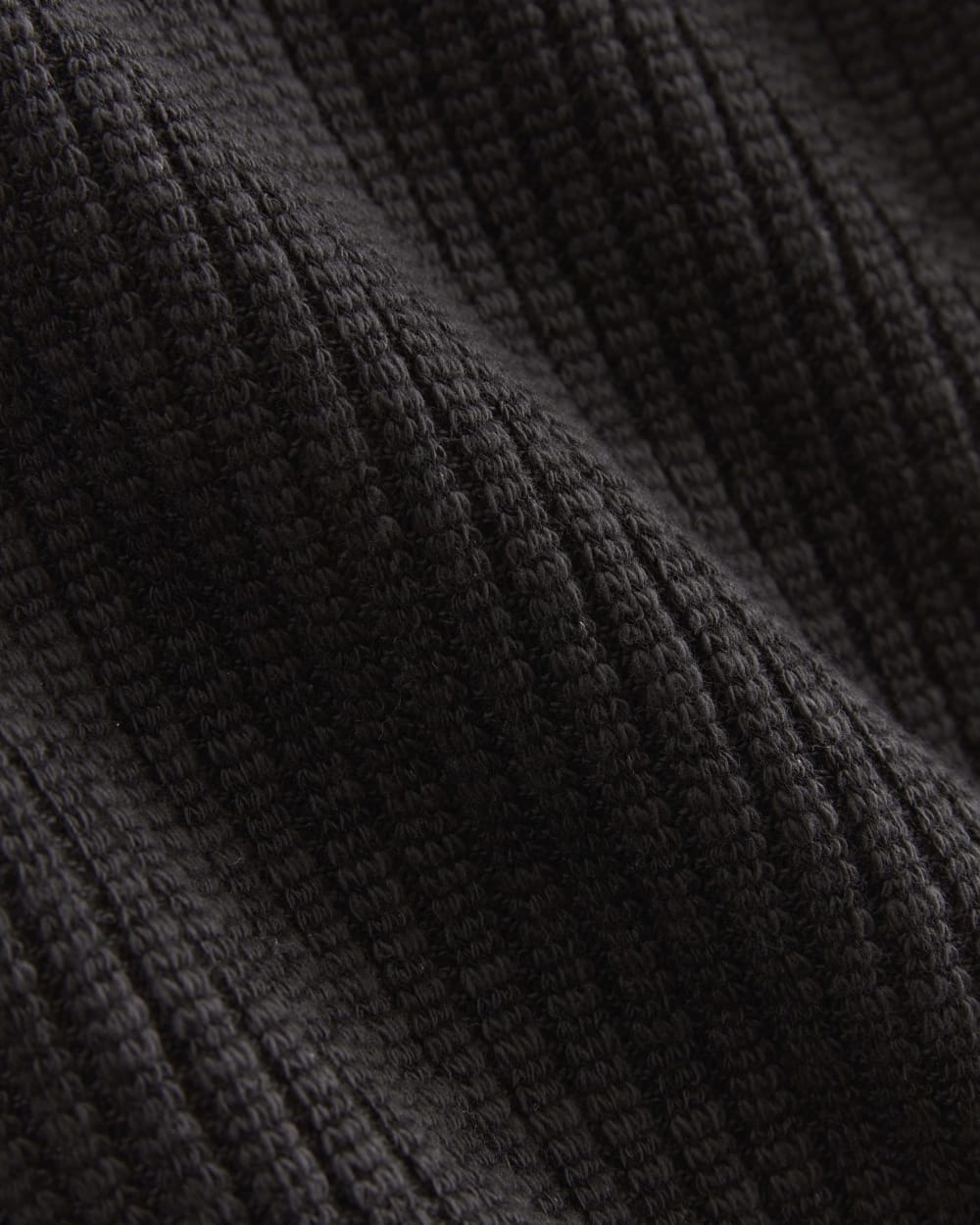 The Rib-Knit Short-Sleeve Henley in Black — detail view