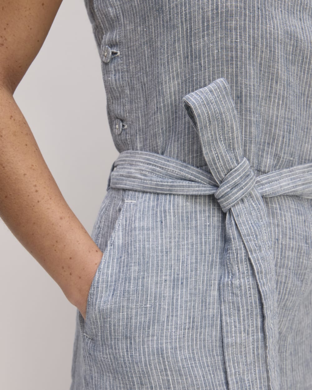 The Linen Side-Button Jumpsuit in White / Blue — detail view
