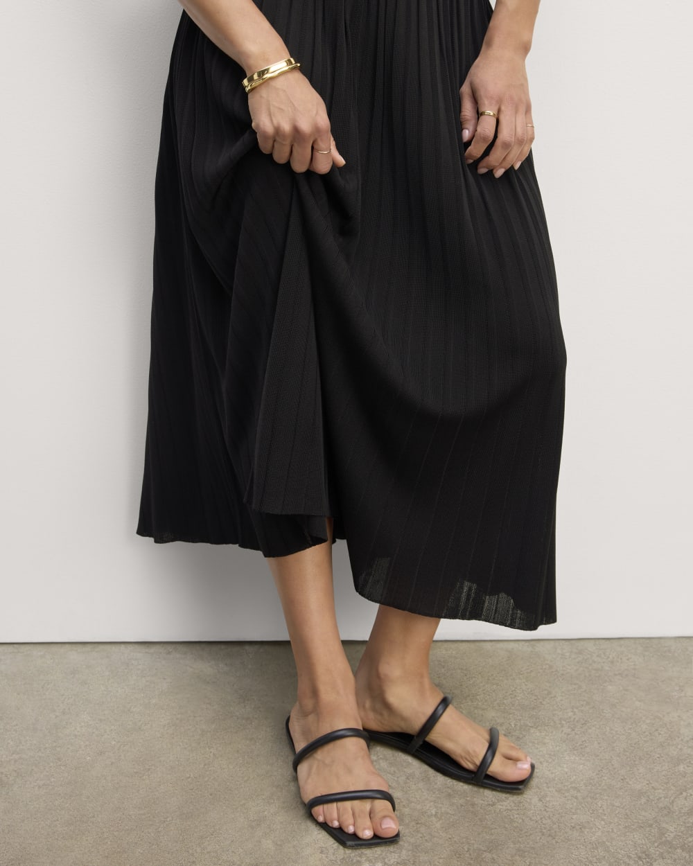The Pleated Skirt in Black — detail view