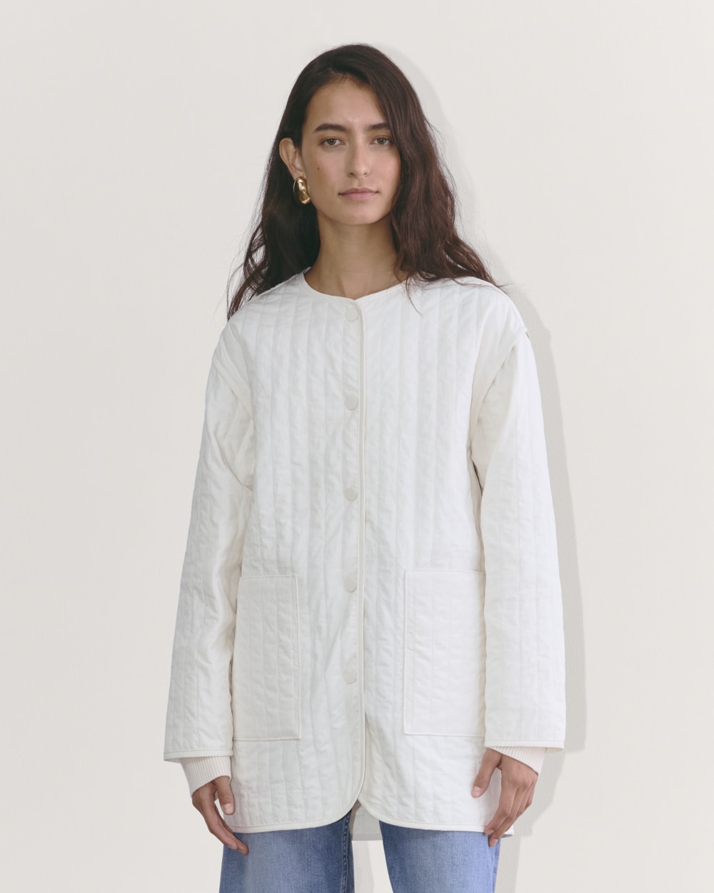 The Midi Quilted Liner in Bone — front view
