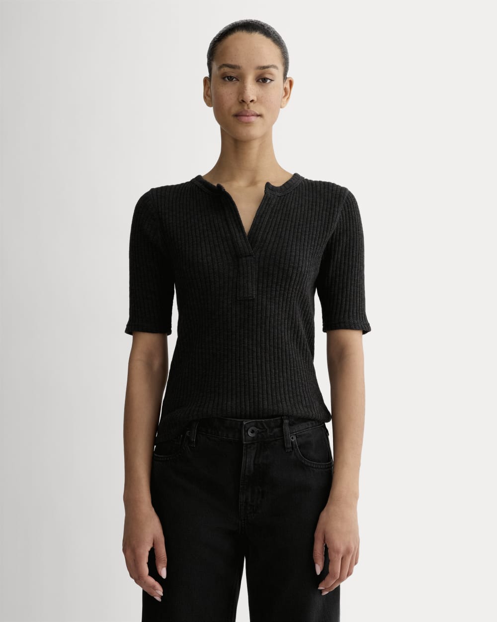The Rib-Knit Short-Sleeve Henley in Black — front view