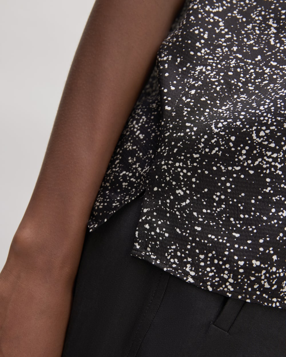 The Satin Racerback Top in Black Moonsplatter — detail view