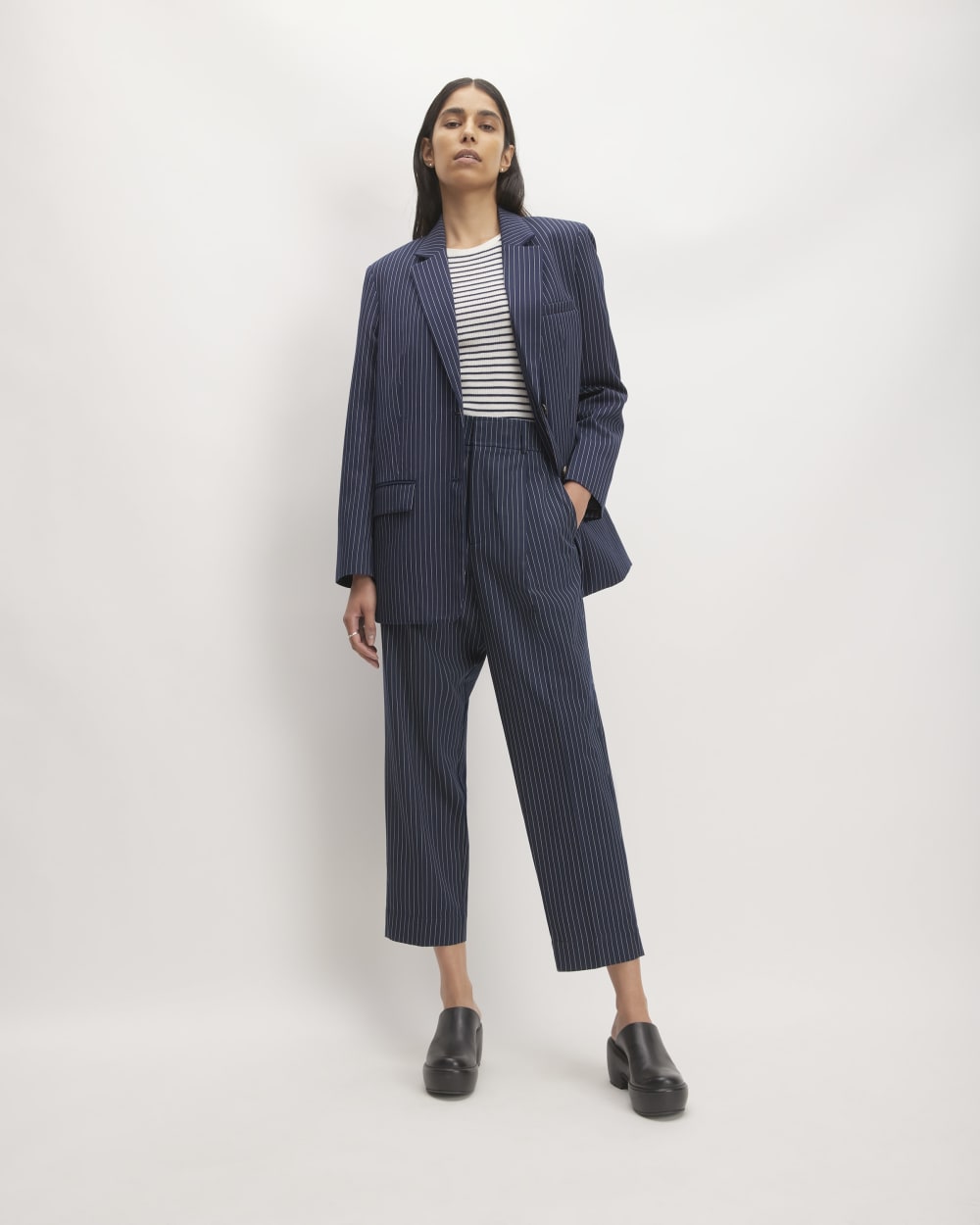 The Draper Tapered Pant in Buttersmooth in Navy / Bone — front view