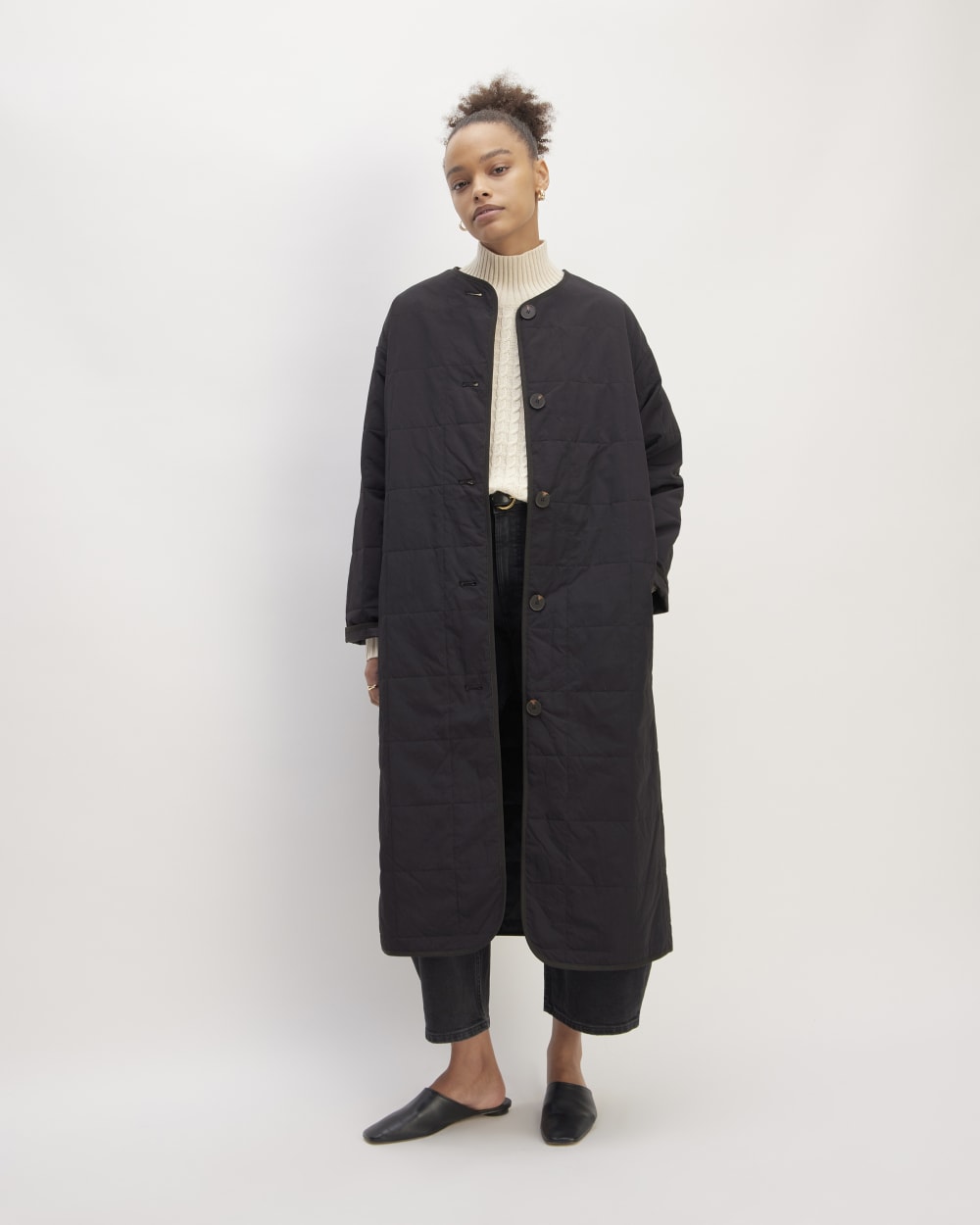 The ReNew Quilted Long Liner in Black — front view