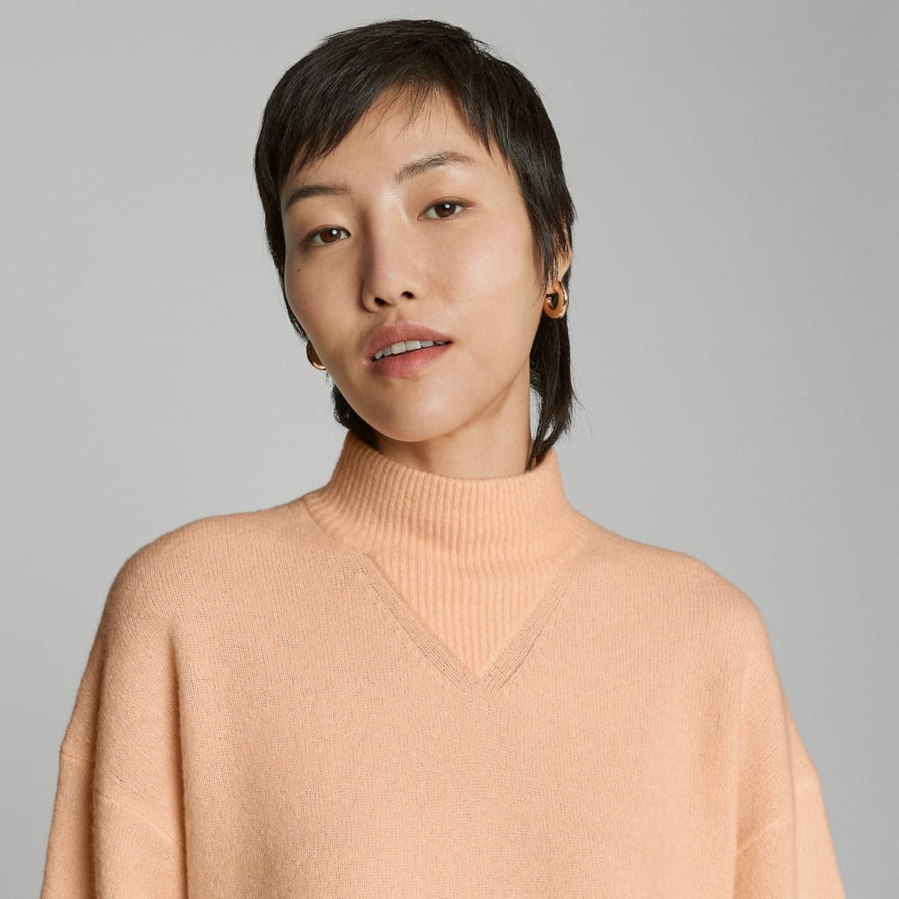 The Cozy-Stretch Pullover in Apricot — detail view