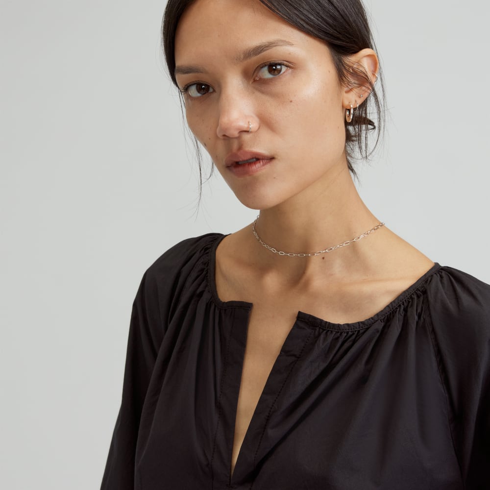 The Raglan Sleeve Poplin Dress in Black — detail view