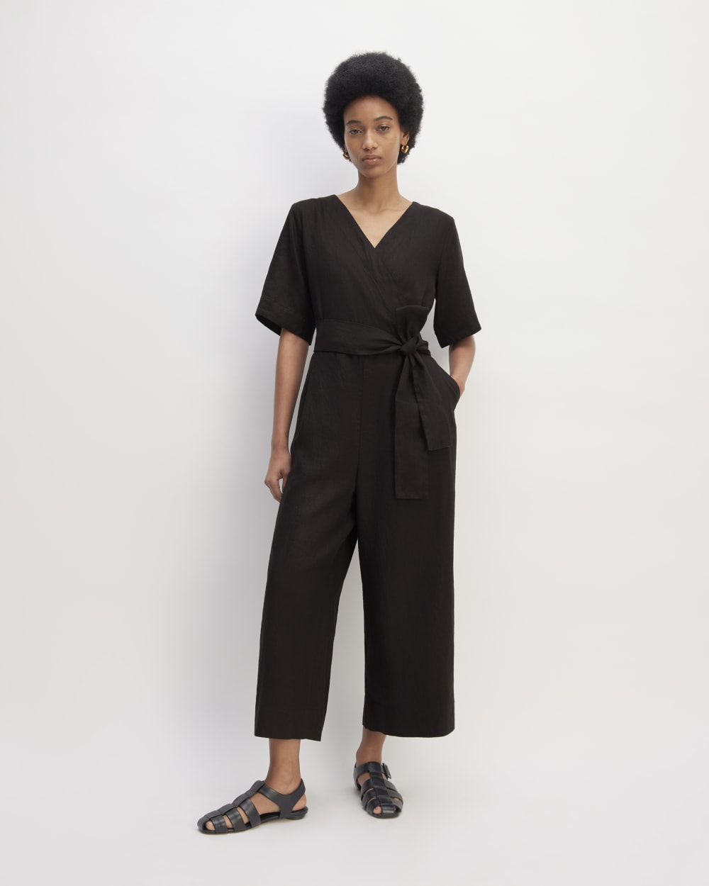 The Wrap Jumpsuit in Linen in Black — front view